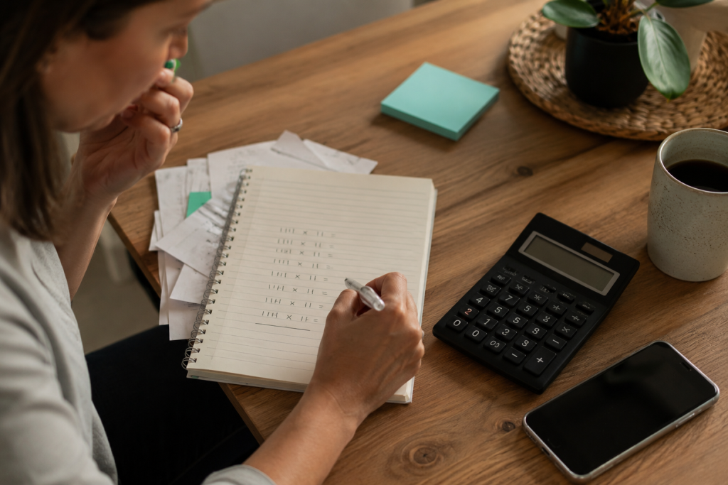 Business owner calculating how much time manual administration tasks add up to across a year