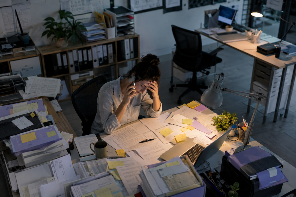 Growing pile of manual administration tasks illustrating how workload compounds as a business scales